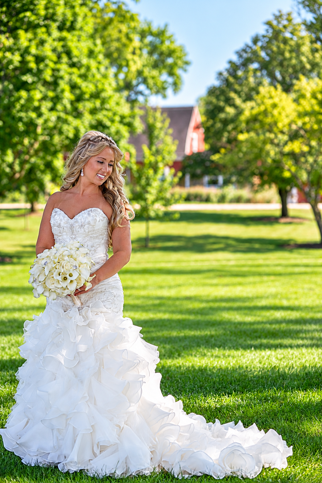 Bride holding a bouquet beside a window